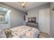 Bedroom with ceiling fan, and furniture, that peeks into the Primary bathroom area at 6103 Stone Rise St, Las Vegas, NV 89135