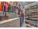 Walk-in closet with custom shelving and drawers for organized storage solutions at 6103 Stone Rise St, Las Vegas, NV 89135