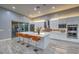 Contemporary kitchen featuring a large center island with seating, stainless steel appliances, and ample counter space at 6103 Stone Rise St, Las Vegas, NV 89135