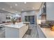 Spacious kitchen with a large center island, modern appliances, and a view into the adjacent living area at 6103 Stone Rise St, Las Vegas, NV 89135