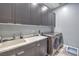 Laundry room features modern appliances, ample counter space, and generous cabinet space at 6103 Stone Rise St, Las Vegas, NV 89135
