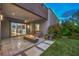 Enjoy the outdoors on this covered patio, featuring tile floors, a built-in fire pit and a cozy seating area at 6103 Stone Rise St, Las Vegas, NV 89135
