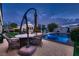 Backyard featuring a gazebo, stone table with chairs and swimming pool with attached spa at 6373 Bridal Cave Ave, Las Vegas, NV 89131