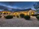 Backyard at dusk with a gazebo and covered patio with furniture at 6373 Bridal Cave Ave, Las Vegas, NV 89131