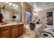 Elegant bathroom with a soaking tub, dual vanities, and tile flooring at 6373 Bridal Cave Ave, Las Vegas, NV 89131