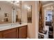 Bathroom features a vanity with ample counter space and a doorway to the adjoining room at 6373 Bridal Cave Ave, Las Vegas, NV 89131