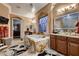 Luxurious bathroom showcasing a large soaking tub, glass bowl sinks and framed mirror at 6373 Bridal Cave Ave, Las Vegas, NV 89131
