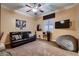 Cozy bedroom featuring a leather sofa, accent art, and a large beanbag at 6373 Bridal Cave Ave, Las Vegas, NV 89131