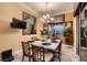 Inviting dining room featuring a stylish chandelier, zebra art and sliding glass door at 6373 Bridal Cave Ave, Las Vegas, NV 89131