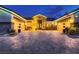 Beautiful facade featuring a brick driveway leading to a home with symmetrical garages and welcoming front entrance at 6373 Bridal Cave Ave, Las Vegas, NV 89131
