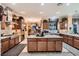 Spacious kitchen featuring an island, stainless steel appliances, and custom cabinetry at 6373 Bridal Cave Ave, Las Vegas, NV 89131