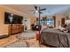 Large main bedroom featuring a four-poster bed, dresser and sitting area at 6373 Bridal Cave Ave, Las Vegas, NV 89131