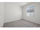 Bedroom with carpet, one window and white walls at 6755 Violet Cascade Ave, Las Vegas, NV 89156
