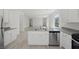 Well-lit kitchen boasts modern appliances and stylish countertops, perfect for cooking at 6755 Violet Cascade Ave, Las Vegas, NV 89156