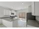 Modern kitchen equipped with stainless steel appliances and easy access to a backyard patio at 6755 Violet Cascade Ave, Las Vegas, NV 89156