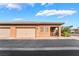 Inviting single-story home featuring a two-car garage, covered porch, and low-maintenance desert landscaping at 715 Orange Plume Walk, Henderson, NV 89011