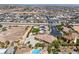 Large lot featuring a custom home, expansive parking, pool, and recreational area, offering unique potential at 7687 W Pebble Rd, Las Vegas, NV 89113