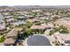 Wide aerial shot captures this desert community and features a single Gathering home with circular driveway and desert landscaping at 7687 W Pebble Rd, Las Vegas, NV 89113