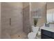Modern bathroom featuring a tiled walk-in shower with a seat at 7687 W Pebble Rd, Las Vegas, NV 89113