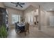 Open-concept dining room with stylish furnishings and plenty of natural light at 7687 W Pebble Rd, Las Vegas, NV 89113