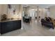 Open-concept dining room featuring a granite-topped sideboard, tile flooring, and elegant decor at 7687 W Pebble Rd, Las Vegas, NV 89113