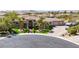 Elegant home featuring a grand entrance, manicured landscaping, and a circular driveway at 7687 W Pebble Rd, Las Vegas, NV 89113