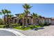 Beautiful single-story home with manicured landscaping, stone accents, lush green lawn, and paved driveway at 7687 W Pebble Rd, Las Vegas, NV 89113
