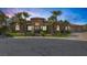 Charming single-story home with lush landscaping and a beautiful stone facade at 7687 W Pebble Rd, Las Vegas, NV 89113