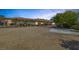Spacious property with a large parking area, mature trees, and a well-maintained exterior at 7687 W Pebble Rd, Las Vegas, NV 89113