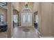 Elegant foyer with double doors, tile flooring, and a view into the dining room at 7687 W Pebble Rd, Las Vegas, NV 89113