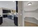 Walk-in pantry featuring plenty of shelving provides ample storage space right off of the kitchen at 7687 W Pebble Rd, Las Vegas, NV 89113