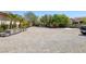Spacious parking area with crushed stone, ideal for multiple vehicles and landscaping potential at 7687 W Pebble Rd, Las Vegas, NV 89113