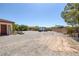 Large gravel parking area with ample room for vehicles and equipment, offering versatile usage at 7687 W Pebble Rd, Las Vegas, NV 89113