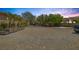 Expansive property with ample parking and a variety of trees and greenery at 7687 W Pebble Rd, Las Vegas, NV 89113