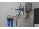 Water filtration system in utility room of home at 7687 W Pebble Rd, Las Vegas, NV 89113