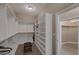 Walk-in closet with custom built-in shelves and ample storage space at 7687 W Pebble Rd, Las Vegas, NV 89113