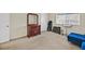 Bedroom featuring a dresser, natural light and musical equipment on neutral carpet at 7901 Idledale Ct # 102, Las Vegas, NV 89145