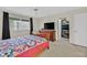 Cozy bedroom with a wooden sleigh bed, dresser and walk-in closet at 7901 Idledale Ct # 102, Las Vegas, NV 89145