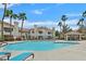 Large community pool with lounge chairs and well-maintained landscaping at 7901 Idledale Ct # 102, Las Vegas, NV 89145