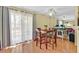 Bright dining area with natural light, table with seating for four, and mirrored wall feature at 7901 Idledale Ct # 102, Las Vegas, NV 89145