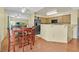 Dining area with kitchen including stainless steel appliances and a breakfast bar at 7901 Idledale Ct # 102, Las Vegas, NV 89145