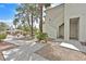 Charming condo with landscaped walkway leading to the front door and community pool view at 7901 Idledale Ct # 102, Las Vegas, NV 89145