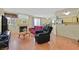 Spacious living room with fireplace, wood floors and an open concept at 7901 Idledale Ct # 102, Las Vegas, NV 89145