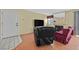 Cozy living room featuring a fireplace, tile entry and hardwood floors at 7901 Idledale Ct # 102, Las Vegas, NV 89145