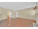 Spacious living room with hardwood floors, neutral walls, and fireplace at 7901 Idledale Ct # 102, Las Vegas, NV 89145