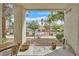 Inviting patio with a view of the community pool and lush landscaping at 7901 Idledale Ct # 102, Las Vegas, NV 89145