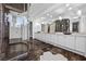 Expansive bathroom with dual vanities, a large mirror, and a luxurious walk-in shower at 9 Greely Club Trl, Henderson, NV 89052