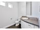 Elegant bathroom with a modern sink, sleek cabinets, and stylish fixtures at 9 Greely Club Trl, Henderson, NV 89052