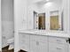 Modern bathroom with white cabinets and marble countertop at 9 Greely Club Trl, Henderson, NV 89052