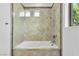 Bathroom view of the tiled shower/tub and the tiled walls surrounding it at 9 Greely Club Trl, Henderson, NV 89052